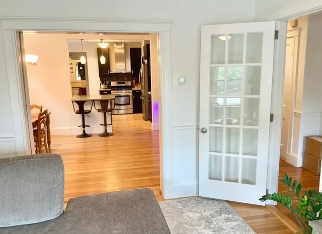 a view of living room filled with furniture and window