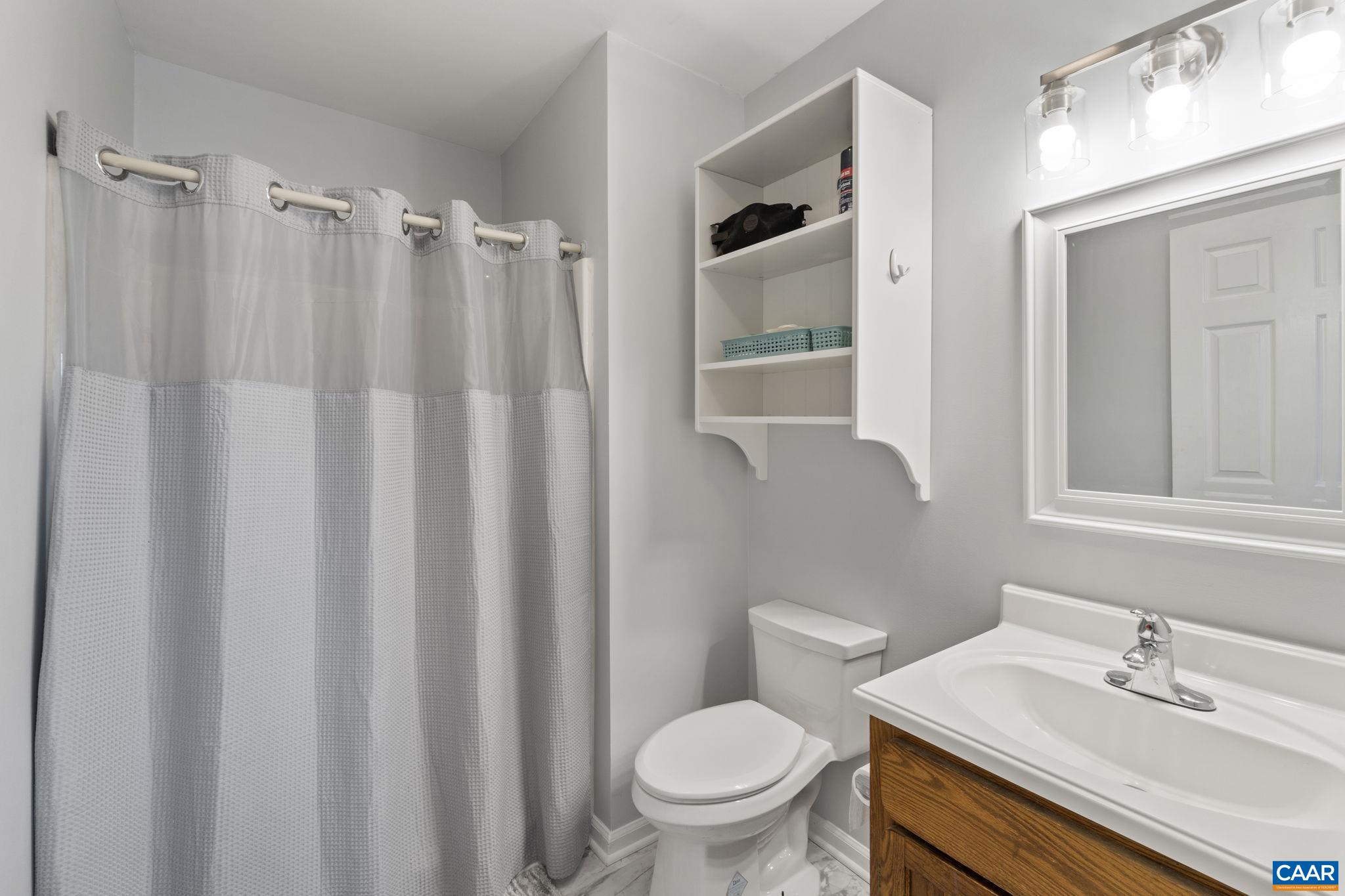 1540 Minor Ridge Court Charlottesville, VA 22901 - Photo 16 of 26 a bathroom with a sink toilet and shower