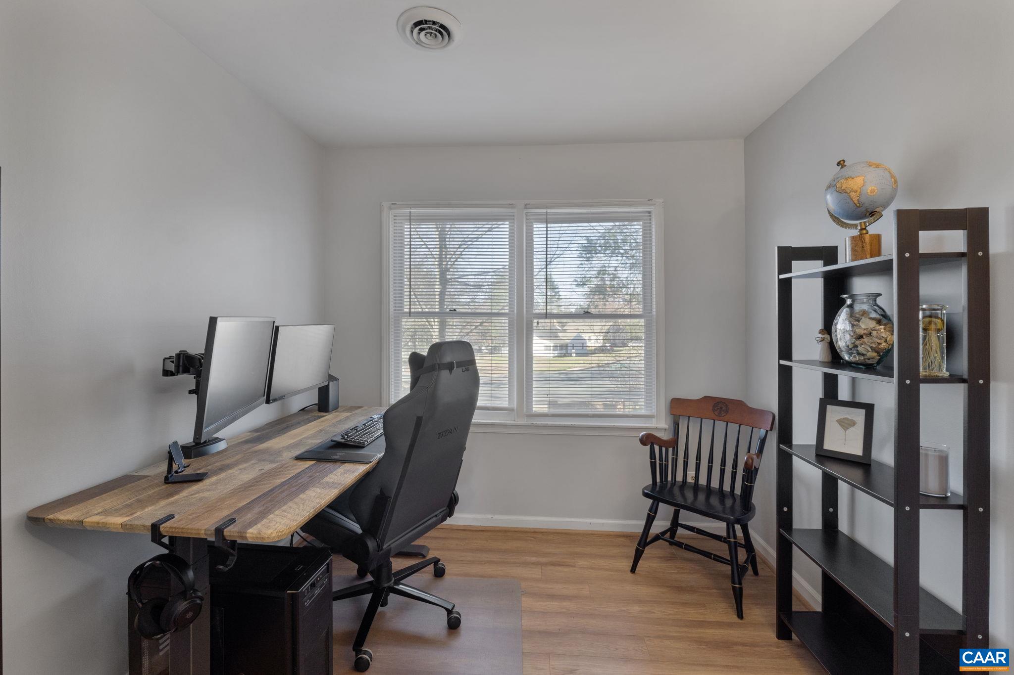1540 Minor Ridge Court Charlottesville, VA 22901 - Photo 18 of 26 a view of a workspace with furniture and a window