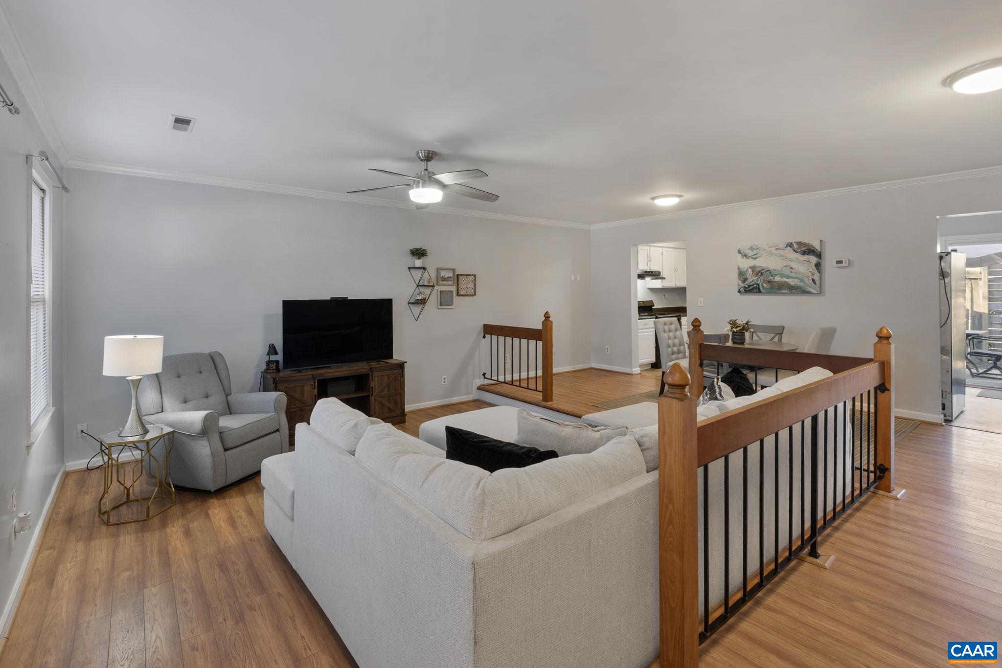 1540 Minor Ridge Court Charlottesville, VA 22901 - Photo 5 of 26 a living room with furniture and a flat screen tv