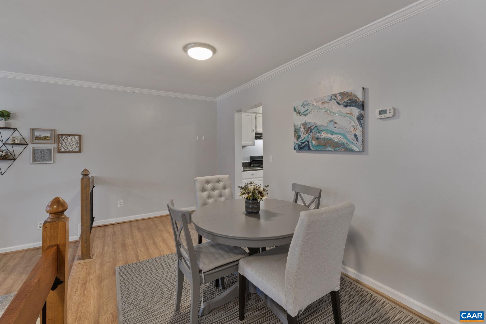 1540 Minor Ridge Court Charlottesville, VA 22901 - Photo 6 of 26 a view of a dining room with furniture and wooden floor