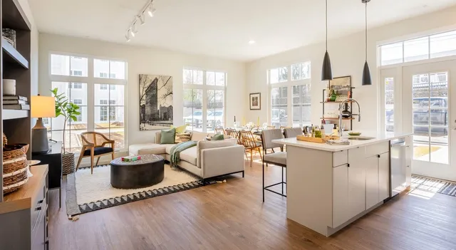 a room with furniture book shelf and a window
