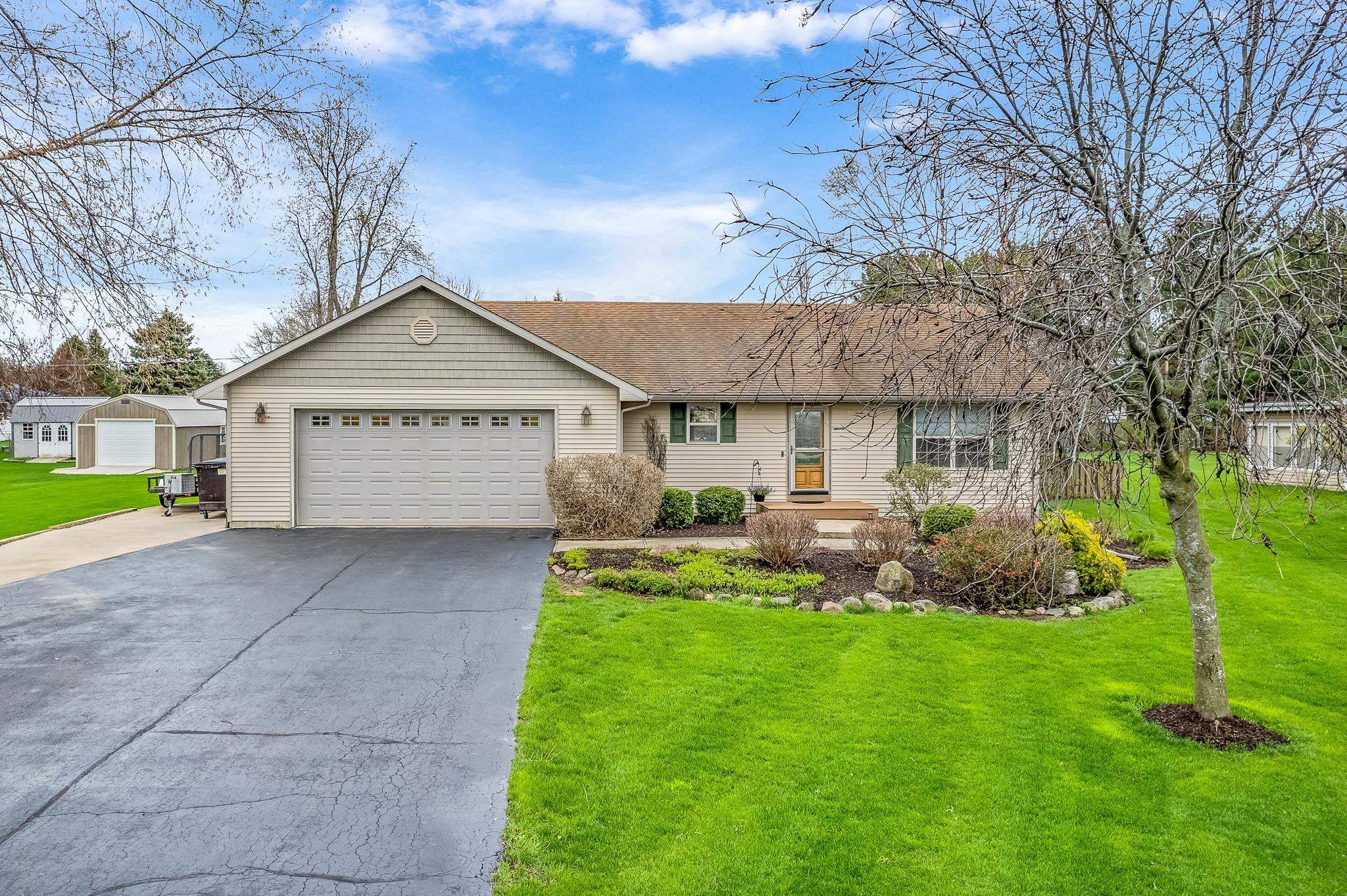2615 Graham Road Belvidere, IL 61008 - Photo 1 of 39 a front view of a house with a yard and garage