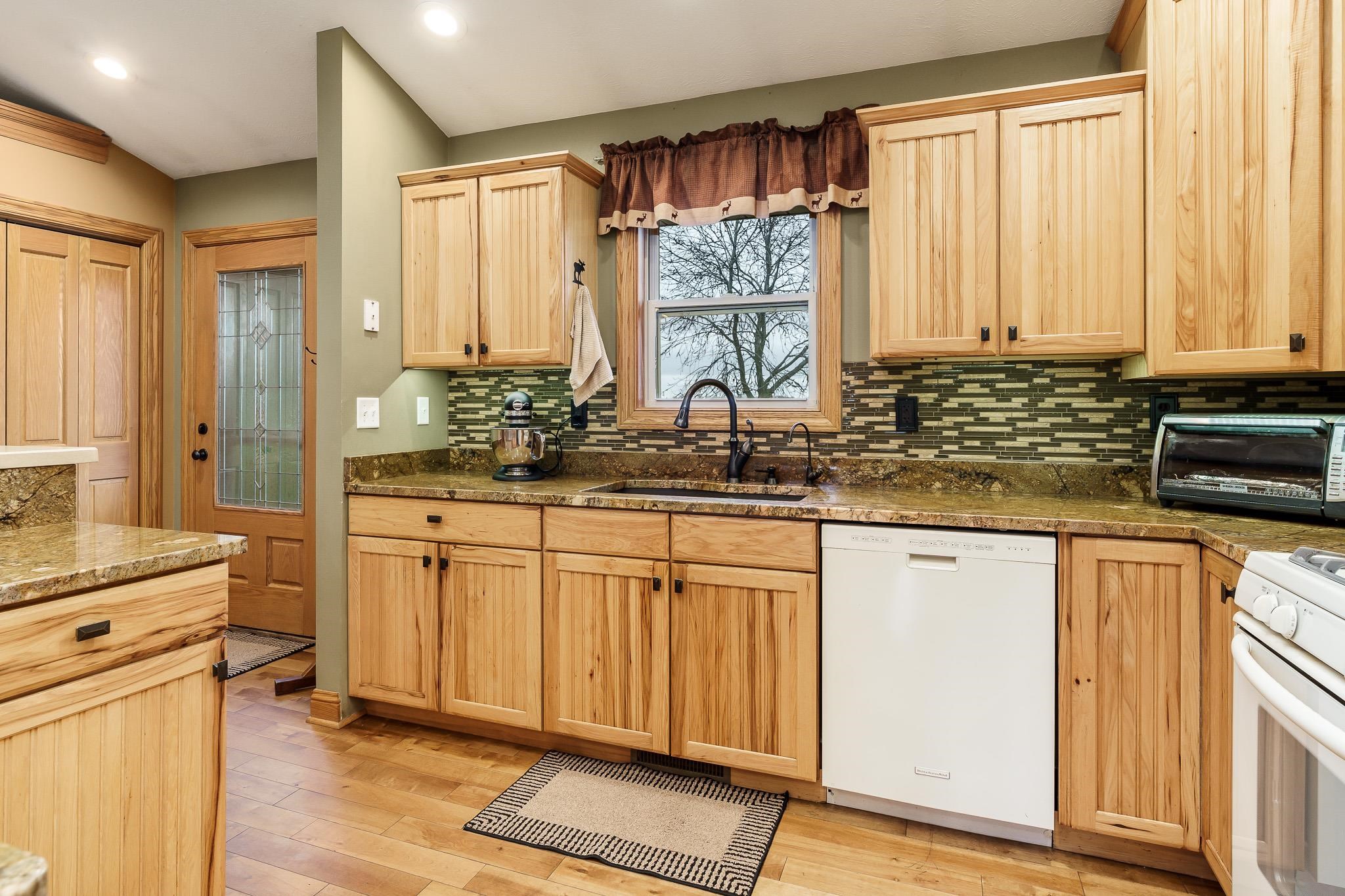2615 Graham Road Belvidere, IL 61008 - Photo 19 of 39 a kitchen with stainless steel appliances a sink cabinets and a window