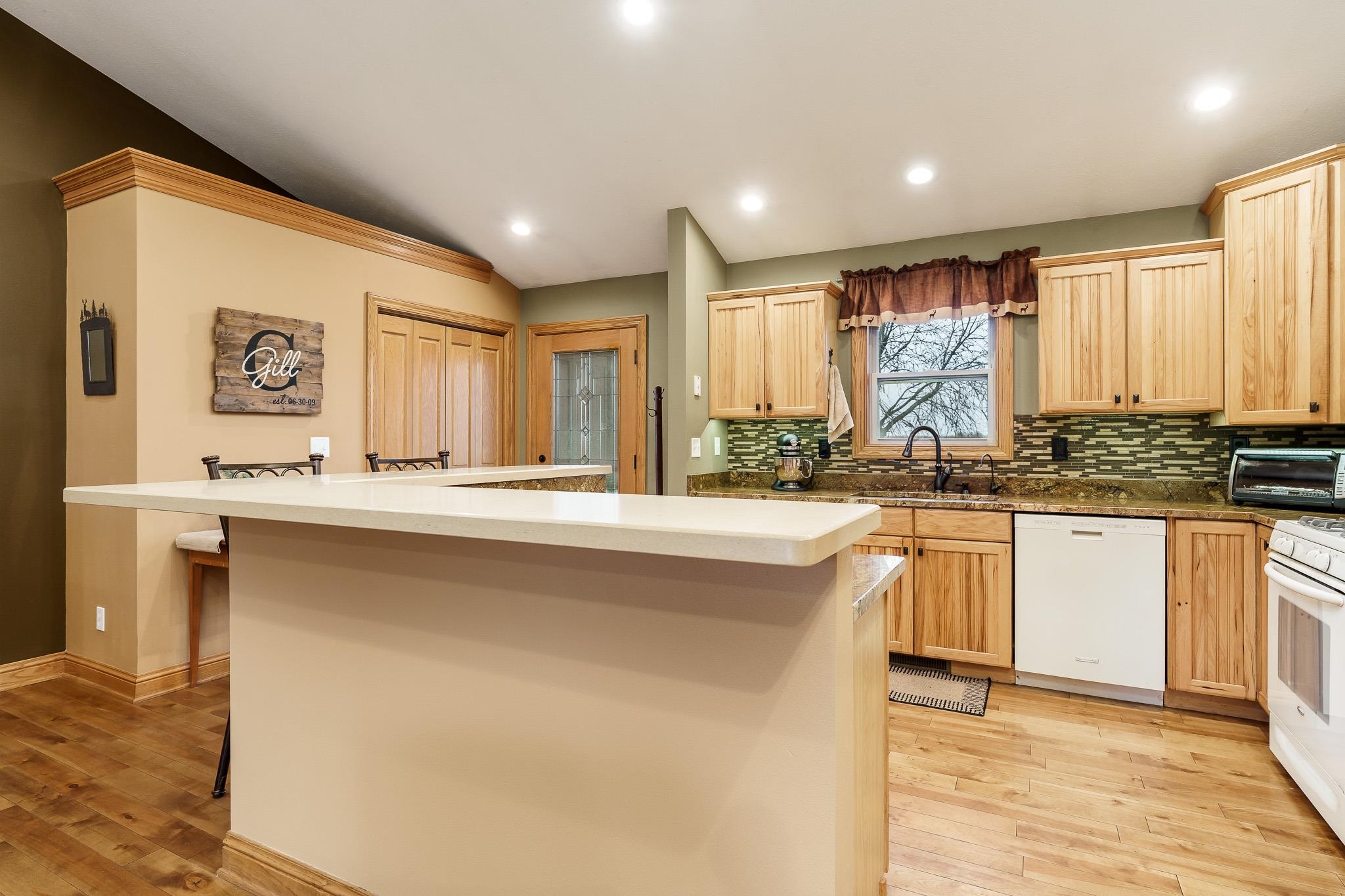 2615 Graham Road Belvidere, IL 61008 - Photo 20 of 39 a kitchen with stainless steel appliances granite countertop a stove a sink and a refrigerator