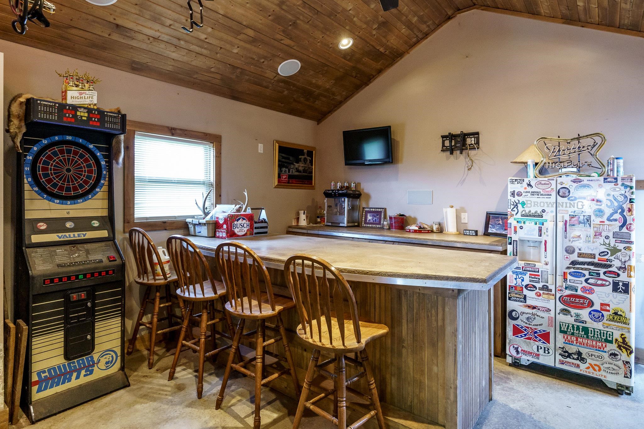 2615 Graham Road Belvidere, IL 61008 - Photo 23 of 39 a kitchen with stainless steel appliances granite countertop a dining table chairs and a refrigerator