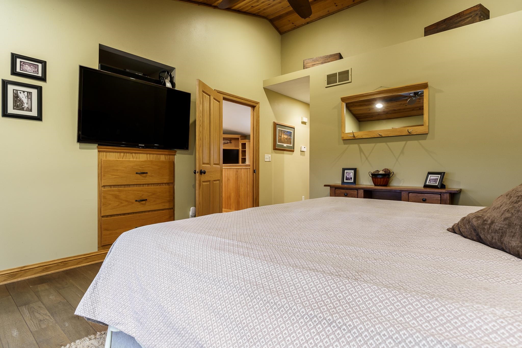 2615 Graham Road Belvidere, IL 61008 - Photo 30 of 39 a bedroom with a bed and a flat screen tv