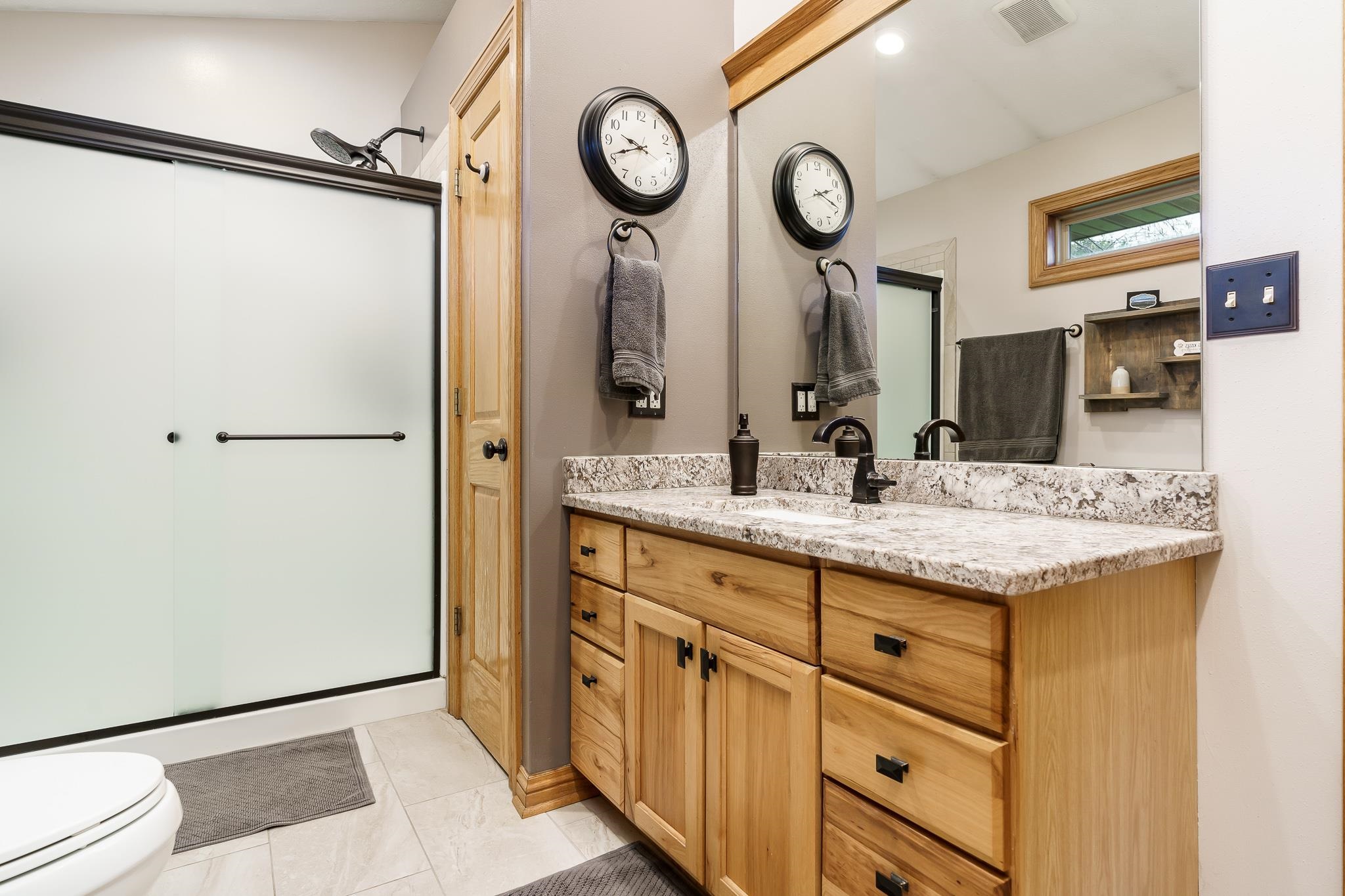 2615 Graham Road Belvidere, IL 61008 - Photo 32 of 39 a bathroom with a granite countertop sink and a mirror