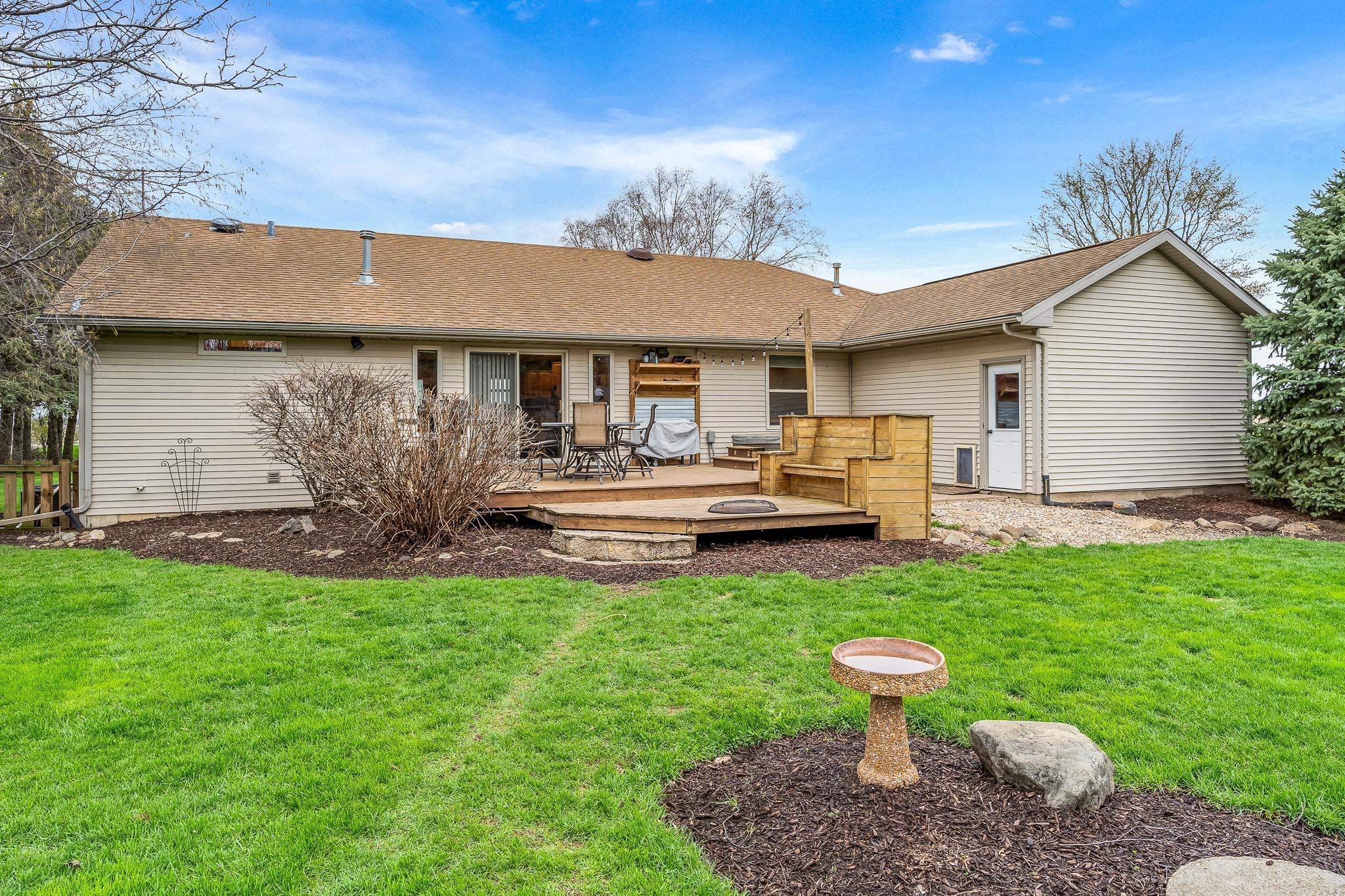 2615 Graham Road Belvidere, IL 61008 - Photo 6 of 39 a front view of a house with garden and trees