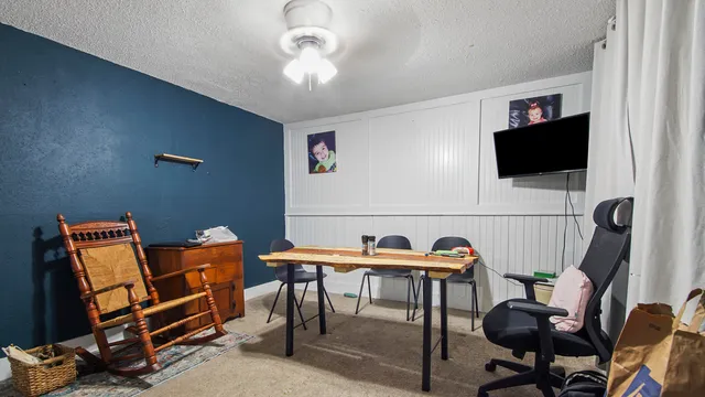 a view of a workspace with furniture