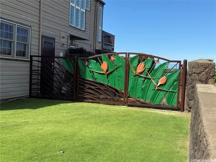 a front view of a building with a garden