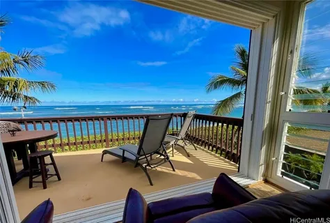 a room with stainless steel appliances kitchen island granite countertop furniture a stove a sink and a large window