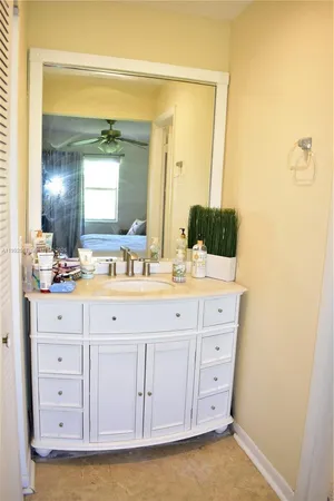 a bathroom with a double vanity sink and mirror