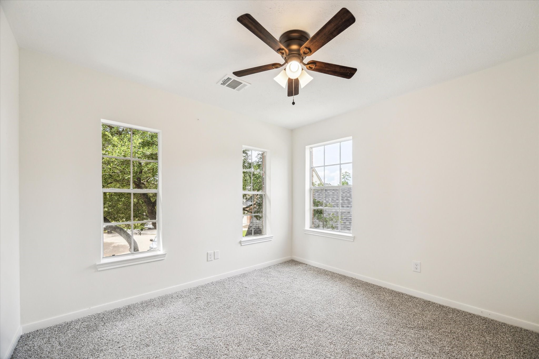 25403 Myrtle Springs Spring, TX 77373 - Photo 14 of 16 an empty room with windows and fan