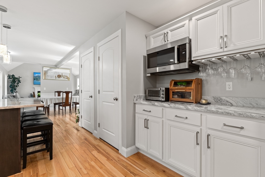 526 Hubbardston Road Templeton, MA 01468 - Photo 8 of 32 a kitchen with stainless steel appliances granite countertop a stove a microwave and cabinets