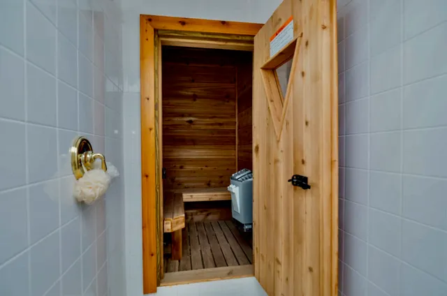 a room with furniture and gym equipment