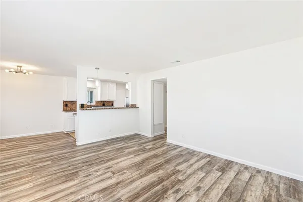 a view of kitchen with wooden floor