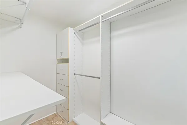 a bathroom with a shower and a sink