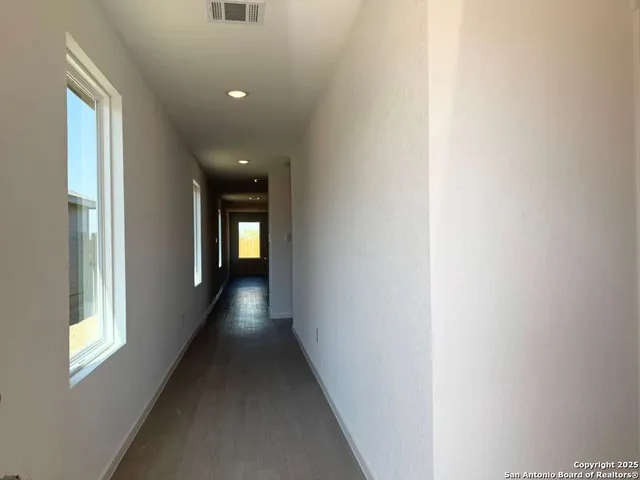 a view of a room that has a window in it