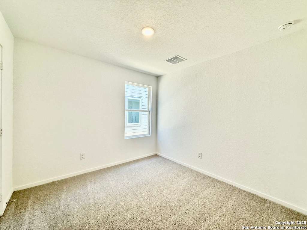 10319 Munoz Manor San Antonio, TX 78214 - Photo 3 of 13 a view of a room that has a window in it