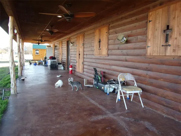 a group of chairs sitting in patio of a house