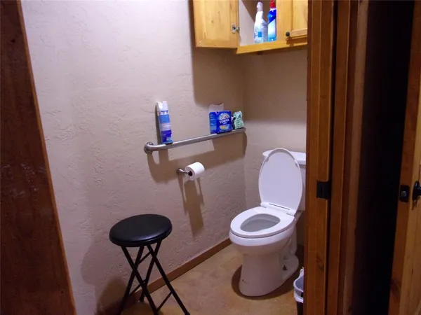 a bathroom with a toilet and a sink