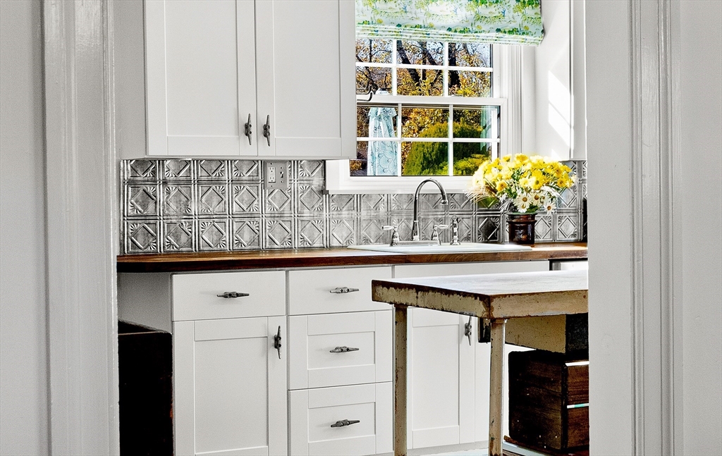 18 Conant Street Beverly, MA 01915 - Photo 11 of 40 a kitchen with a sink and cabinets