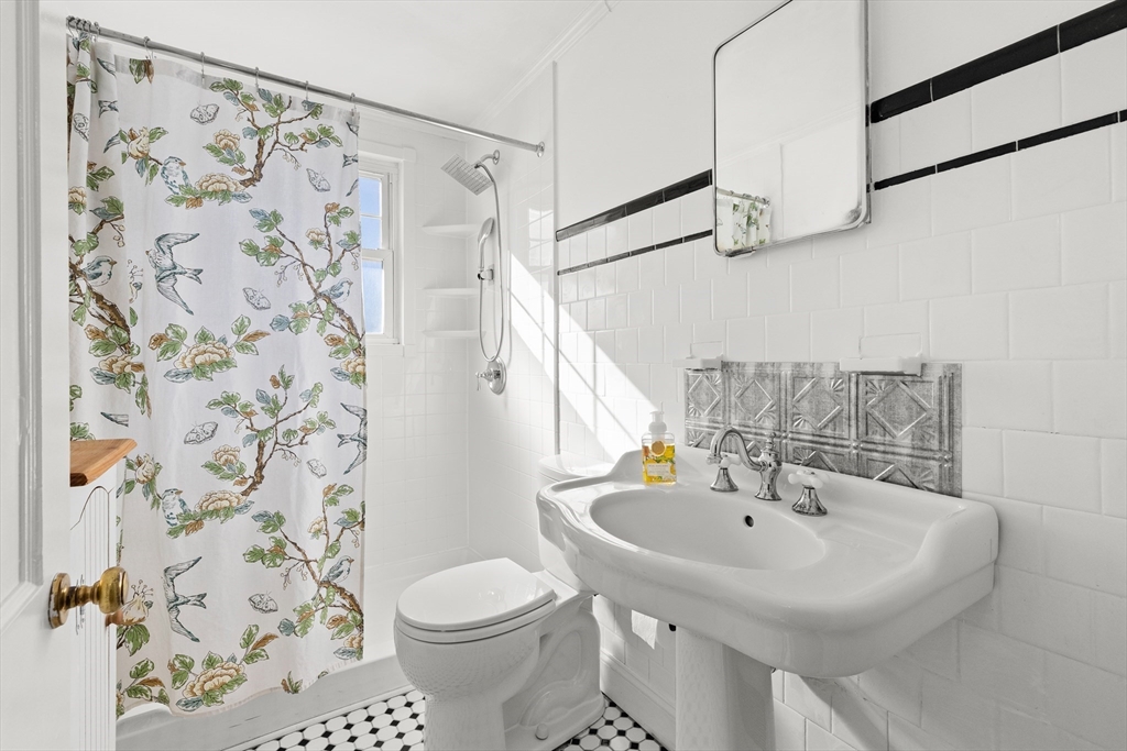 18 Conant Street Beverly, MA 01915 - Photo 13 of 40 a bathroom with a sink and a mirror