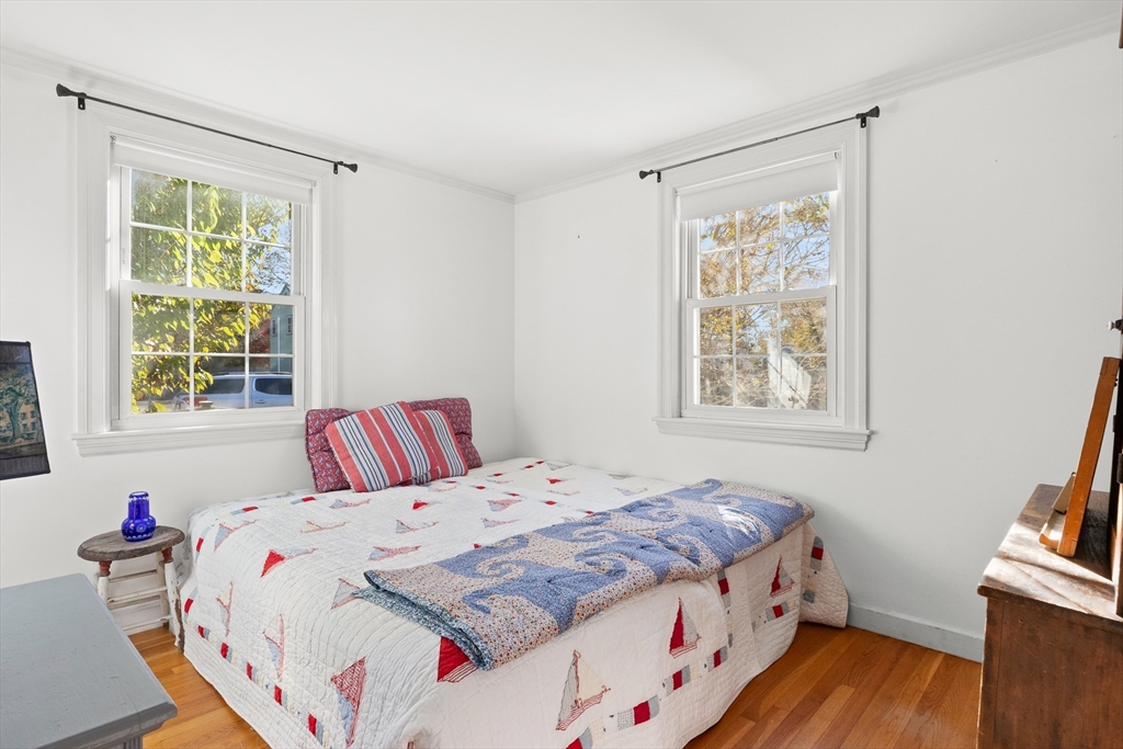 18 Conant Street Beverly, MA 01915 - Photo 14 of 40 a bedroom with a bed and a window