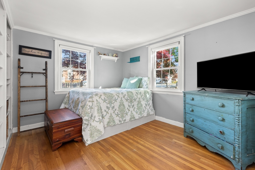 18 Conant Street Beverly, MA 01915 - Photo 15 of 40 a bedroom with a bed and a flat screen tv