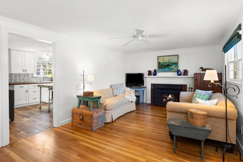 18 Conant Street Beverly, MA 01915 - Photo 16 of 40 a living room with furniture a fireplace and a table
