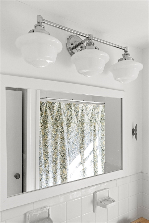 18 Conant Street Beverly, MA 01915 - Photo 25 of 40 a bathroom with a bathtub and window