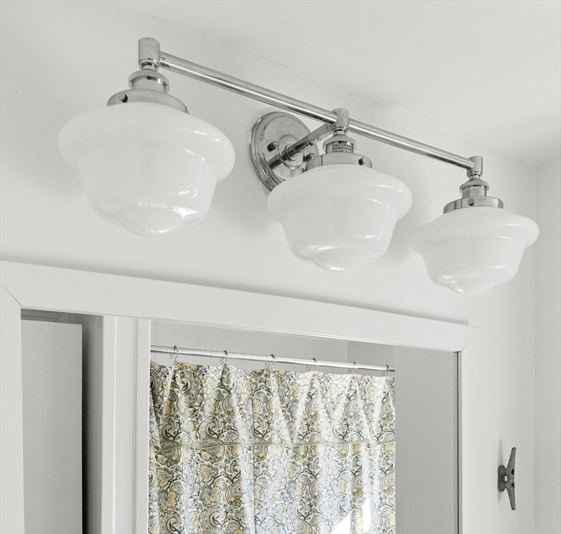 18 Conant Street Beverly, MA 01915 - Photo 26 of 40 a bathroom with a sink and a shower curtain