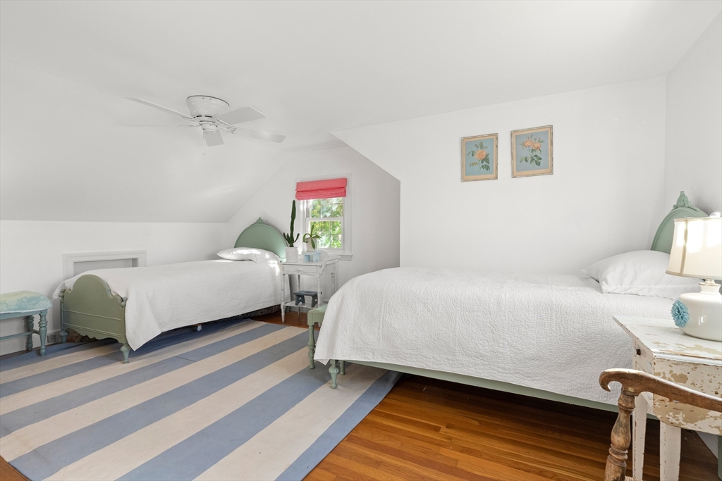 18 Conant Street Beverly, MA 01915 - Photo 27 of 40 a bedroom with a bed and wooden floor