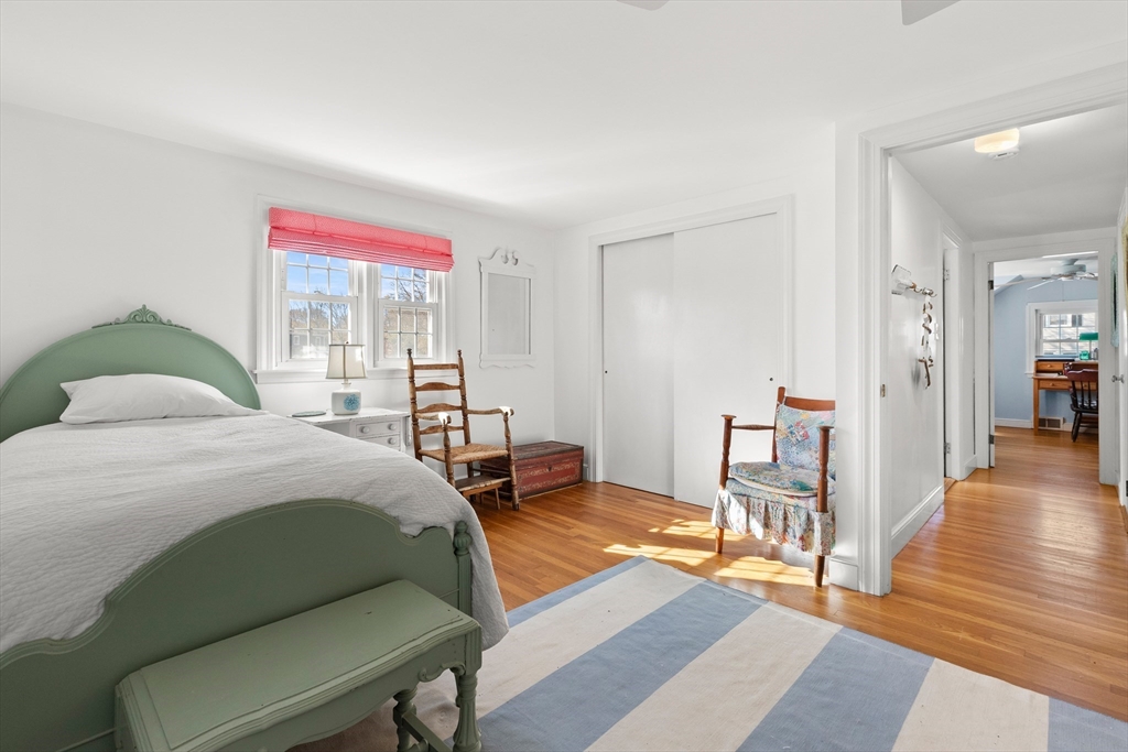 18 Conant Street Beverly, MA 01915 - Photo 28 of 40 a bedroom with a bed and wooden floor