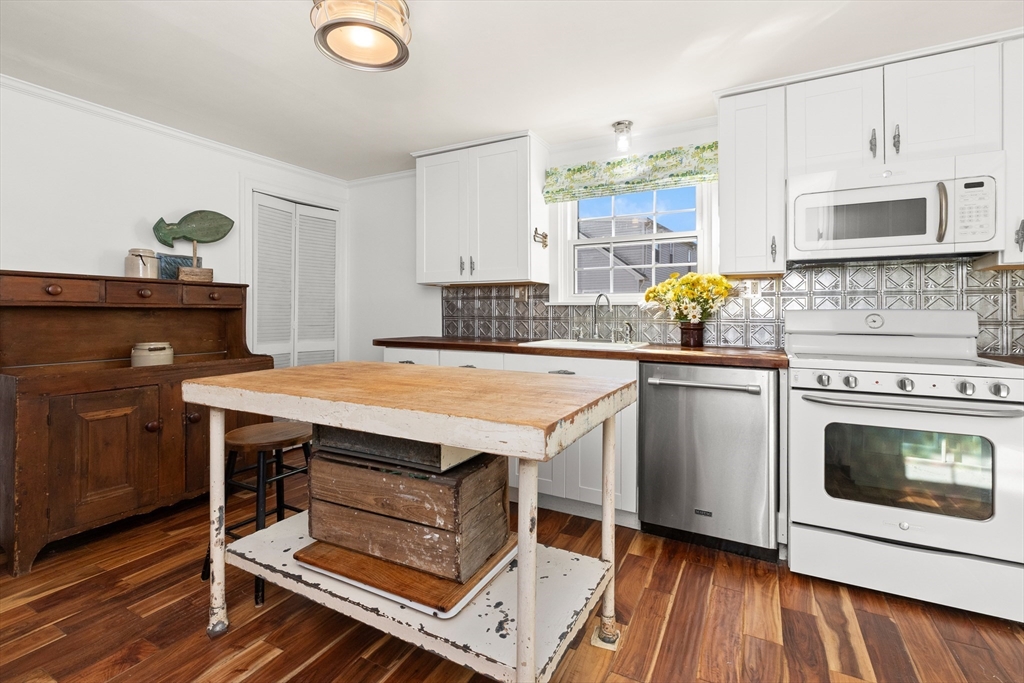 18 Conant Street Beverly, MA 01915 - Photo 5 of 40 a kitchen with a stove and a sink