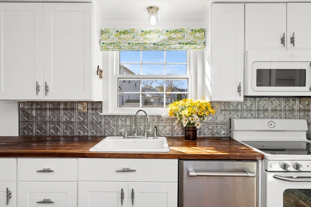 18 Conant Street Beverly, MA 01915 - Photo 6 of 40 a kitchen with a stove and cabinets
