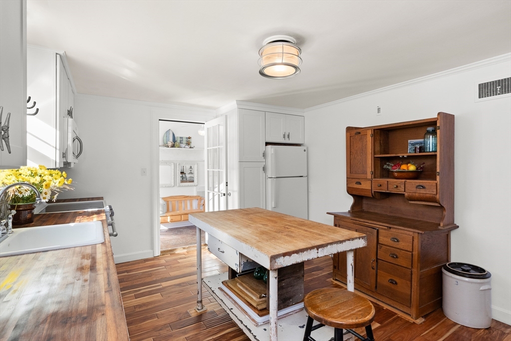 18 Conant Street Beverly, MA 01915 - Photo 7 of 40 a kitchen with a table and chairs