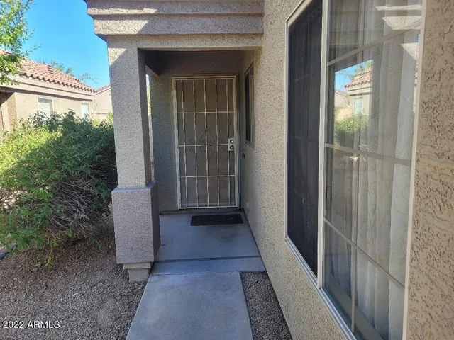 a view of a door and wooden floor