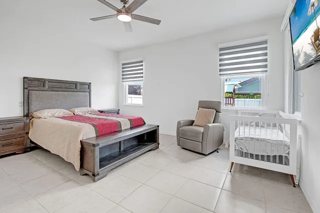 a bedroom with a bed and a couch