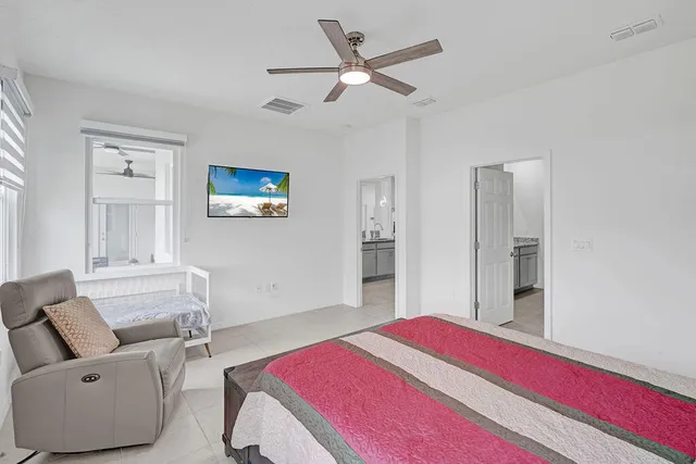 a bedroom with a bed and a couch