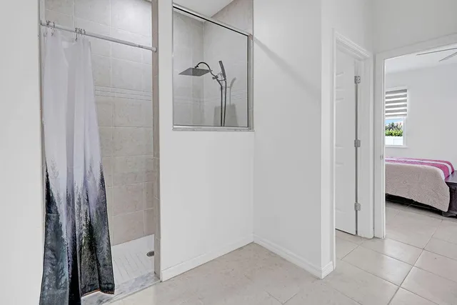 a bathroom with a shower and a sink