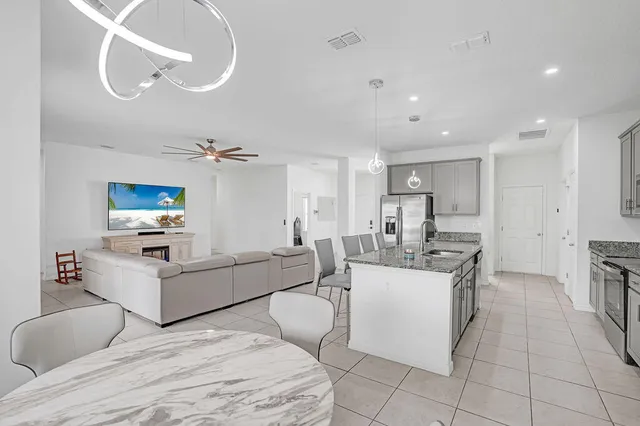 a living room with furniture and a table