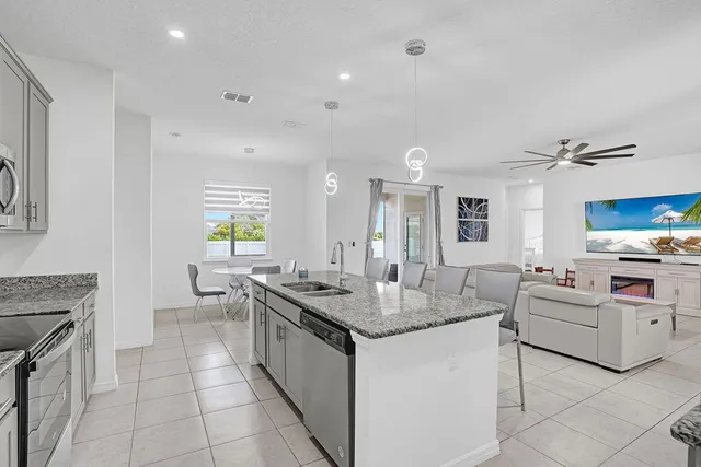 a view of living room with granite countertop furniture and fireplace