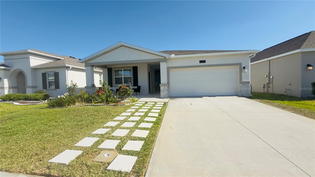 5321 Amersham Lane St. Cloud, FL 34771 - Photo 1 of 1 a front view of a house with garden