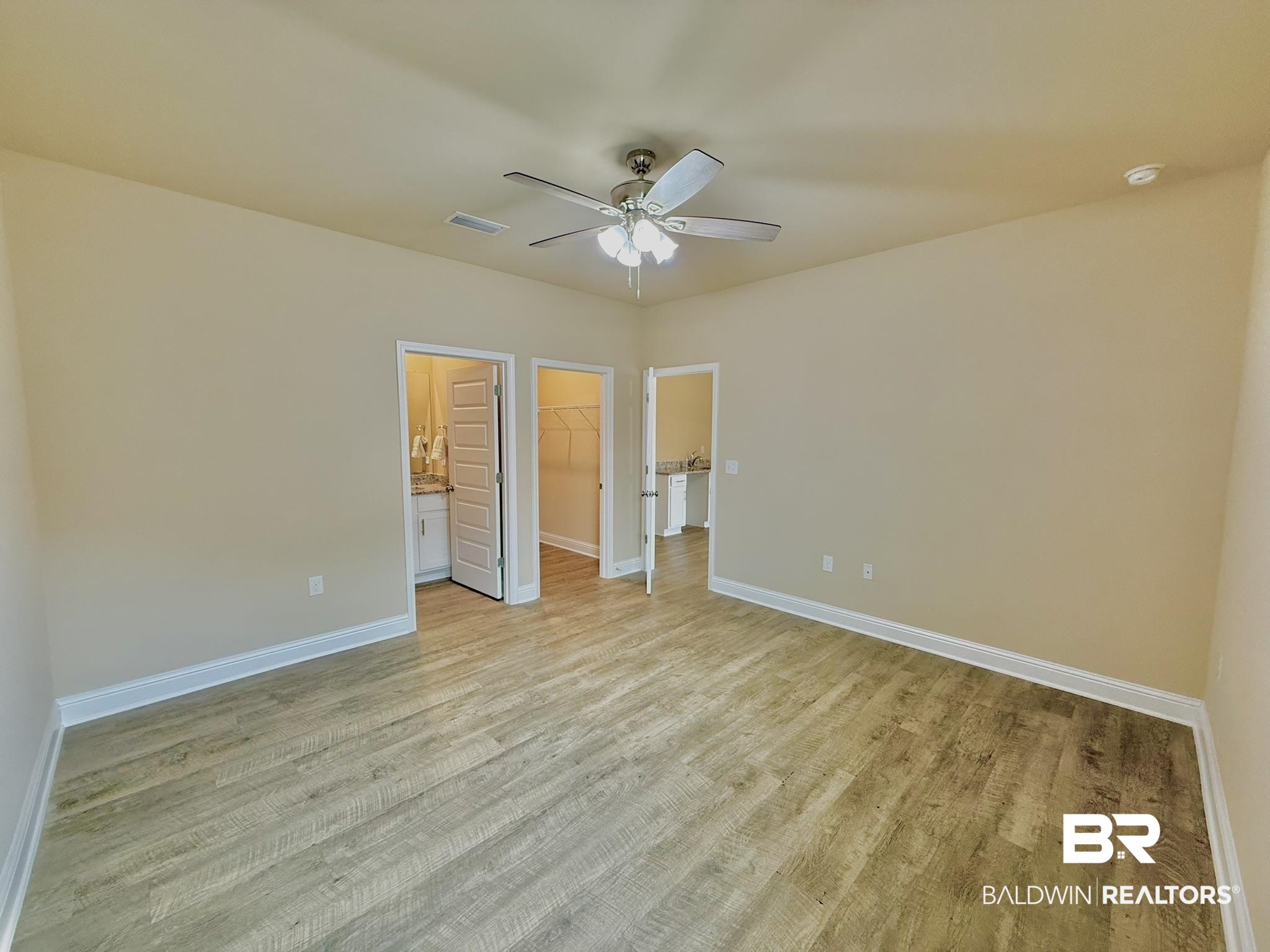 8648 Calverton Street Foley, AL 36535 - Photo 36 of 45 Unfurnished bedroom featuring light wood-style floors, a spacious closet, a closet, and a ceiling fan