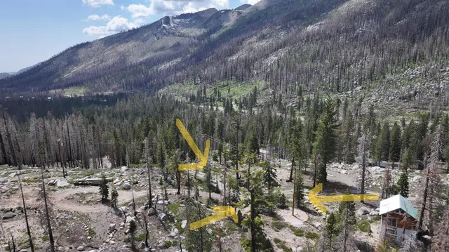 a view of a house with a yard and sitting area