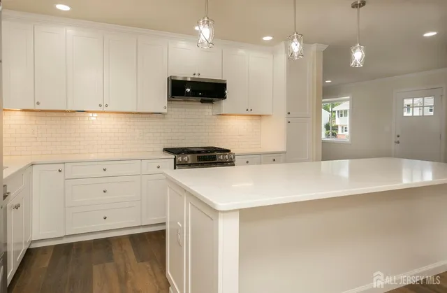 a bathroom with a double vanity sink and mirror