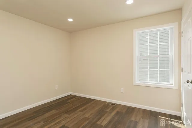 a bathroom with a toilet sink and shower