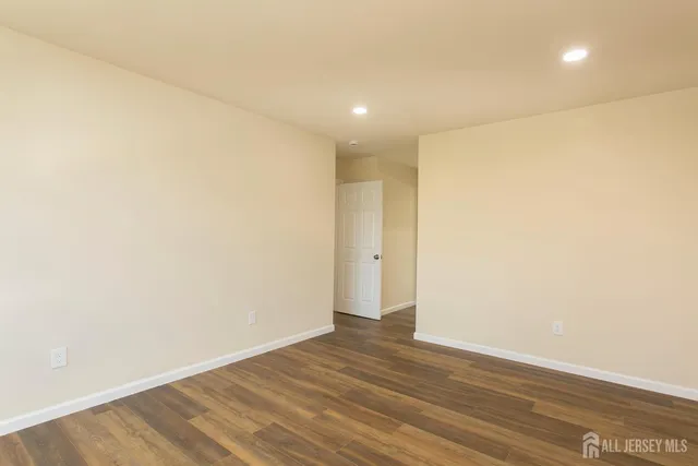 a view of a hall with wooden floor